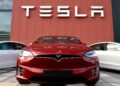 The logo marks the showroom and service center for the US automotive and energy company Tesla in Amsterdam on October 23, 2019. (Photo by JOHN THYS / AFP) (Photo by JOHN THYS/AFP via Getty Images)